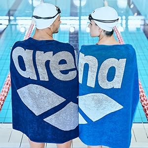 athletes wearing arena swim caps swim goggles and matching towels from team line collection