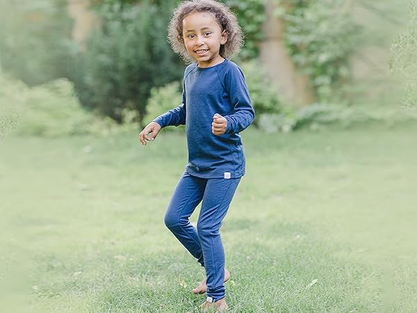 Kid wearing Woolino Merino Wool Thermal Top & Legging in Deep Blue.