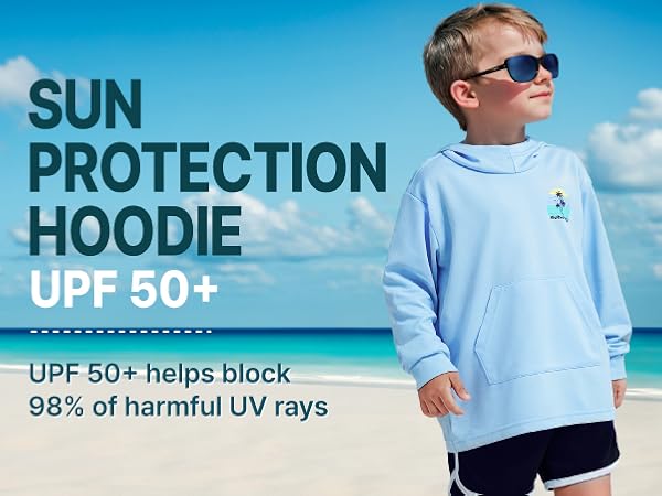 little boy is wearing a sun protection hoodie at the beach