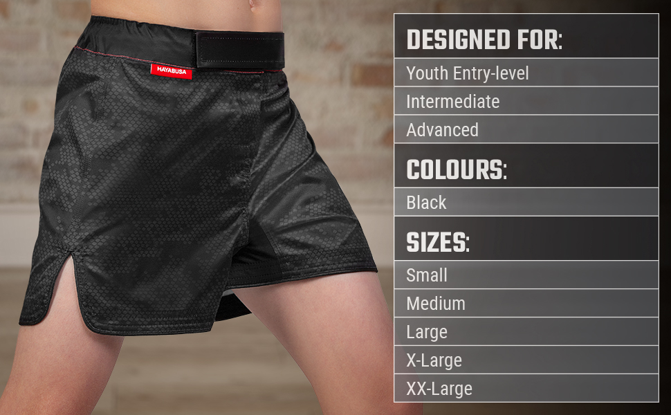 Youth wearing Black Hexagon Kids Fight Shorts