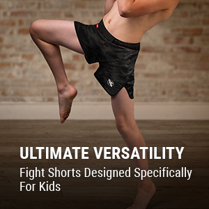 Youth doing a front Kick in Youth Hexagon MMA Shorts